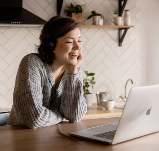 Woman having a videocall on her laptop